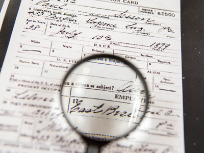 Magnifying glass and census document