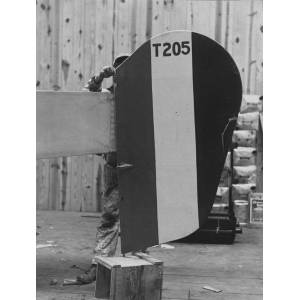 A Worker Installs a Tail with the Iconic Allied Colour Pattern