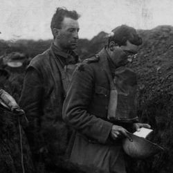 A Chaplain of the Munsters Saying a Prayer over Bodies of two British Soldiers Killed in a Front Line Trench. Cambrai. 