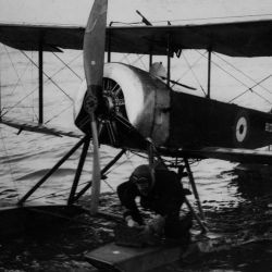 British Aviator Releasing Pigeons. At least Two Pigeons are Carried on each Seaplane so that Messages may be Sent in Duplicate