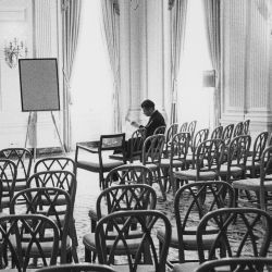 Advisors: Secretary of Defense Robert McNamara alone in meeting room