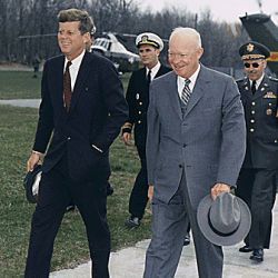 Meeting with President Eisenhower. President Kennedy, President Eisenhower, military aides. Camp David, MD.