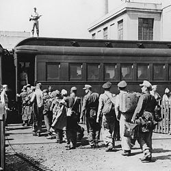 WWII: "German POWs board a train in Boston"