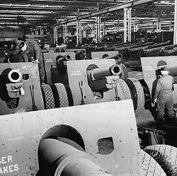 American-built 155 mm howitzers shipped to England as lend-lease reach an ordnance depot on their way to action