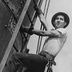 An ironworker climbs a 16 foot by 60 foot stack at the Tennessee Valley Authority Watts Bar Dam Hydroelectric Plant