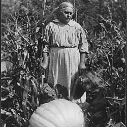 Woman with large pumpkin at Cass Lake
