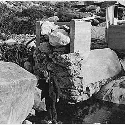 Aqua Caliente Reservation. Andreas Canyon Dam washed out February 1927. Rocks in the abutment removed 3/10/28