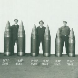 Workmen Displaying Various Types and Sizes of World War I Era Shells
