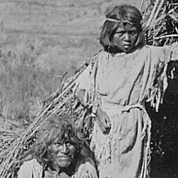 The Arrow Maker and his daughter, Kaivavit Paiutes, in front of their home, northern Arizona