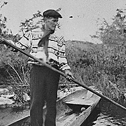 A Seminole spearing a garfish from a dugout
