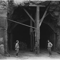 West entrance to Zion Tunnel. Zion Tunnel is 6000 feet long, cut through solid sandstone. It is said to be the longest highway tunnel in the world with the exception of the tubes under the Hudson Rive