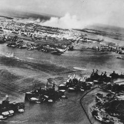Captured Japanese photograph taken during the attack on Pearl Harbor, Dec. 7, 1941. In the distance, the smoke rises from Hickam Field.