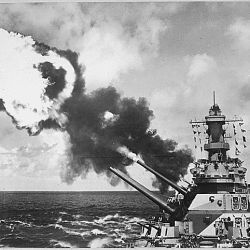 16 inch guns of the USS Iowa firing during battle drill in the Pacific.