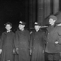 Western Union Messengers on night duty, 10:30 P.M. Left to right, Joseph Strassburg (had just gotten off), Leo Lipschitz, Robert Strassburg (brother of Joseph). Boys could not be over 12 years old. Al