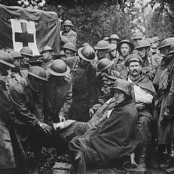 Wounded German prisoners receiving medical attention at first-aid station of 103rd and 104th Ambulance Companies. German second-line trench