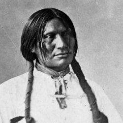Big Foot (Sitanka), a Miniconjou Sioux of Cheyenne River Reservation, South Dakota; half-length, seated, wearing white shirt 