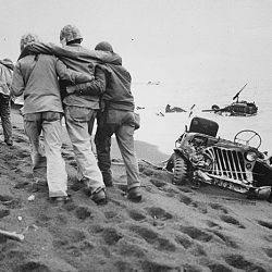 They did their part. Wounded Marines are helped to an aid station by Navy corpsmen and Marine walking wounded. Iwo Jima