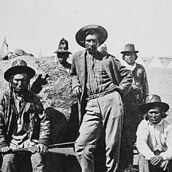 Warm Spring scouts, Lava Beds, California; their leader, Donald McKay, is leaning against rock