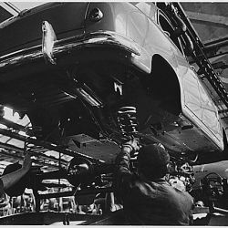 Italy. The begining of the "1400" assembly line. The bodies are lowered gently onto the chassis