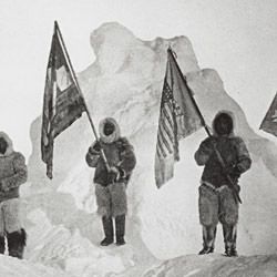 Photograph of the Robert Peary Sledge Party Posing with Flags at the North Pole