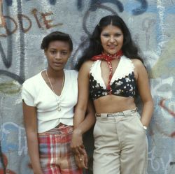 Two Latin Girls Pose in Front of a Wall of Graffiti in Lynch Park in Brooklyn, New York City
