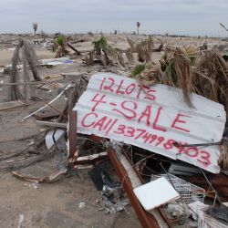 [Hurricane Katrina] Holly Beach, LA, 1-27-06 -- A sign by a local resident offering debris covered lots for sale. Some residents at Holly Beach are unable to clean up after Hurricane Rita and giving u