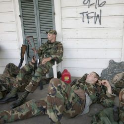 [Hurricane Katrina] Bywater, LA, 9/20/2005 -- Exhausted National Guardsmen take a break from patroling isolated communities around New Orleans. Only residents and emergency workers are allowed access 