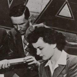 A Crate of Lettuce Gets First Class Attention from a Pilot, Flight Attendant, and an Unidentified Man Before Flying to the East Coast 