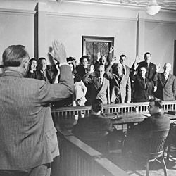Photograph of County Clerk "Bun" Towner Swearing-in a Trial Jury in the Court House