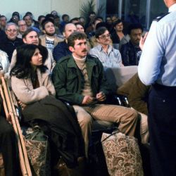 Evacuees from the US Embassy in Tehran, Iran, are briefed upon their arrival at the air base terminal.
