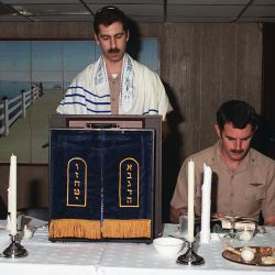 Crew members participate in the Jewish celebration of Passover