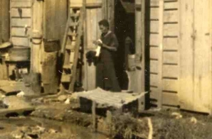 Woman in the Doorway of a Shack