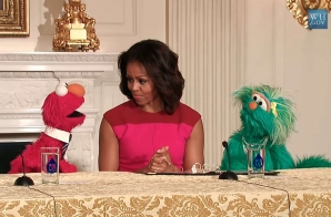 First Lady Michelle Obama with Sesame Street Muppets Elmo and Rosita