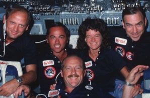Crew members pose for group portrait on forward flight deck