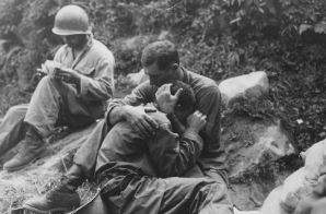 A Grief Stricken American Infantryman Comforted by Another Soldier