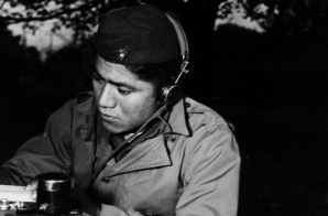 Corporal Lloyd Oliver, Navajo, Operates a Field Radio While Attached to a Marine Artillery Regiment in the South Pacific