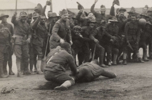 Colonel William Hayward, 369th Infantry, deciding a close play at the plate