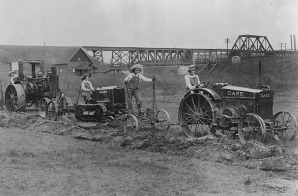 "Farmerettes" Guiding Tractors