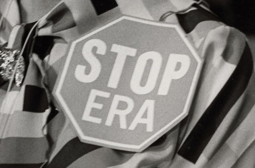 Woman Wearing a "Stop ERA" Badge