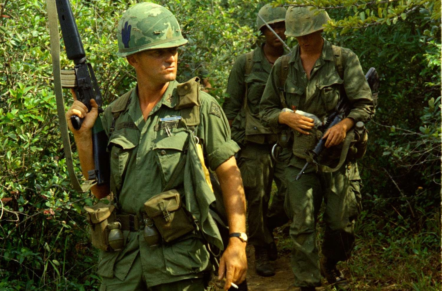 Captain Larry W. Bass and Other Members of His Company Come out of a Viet Cong Cave