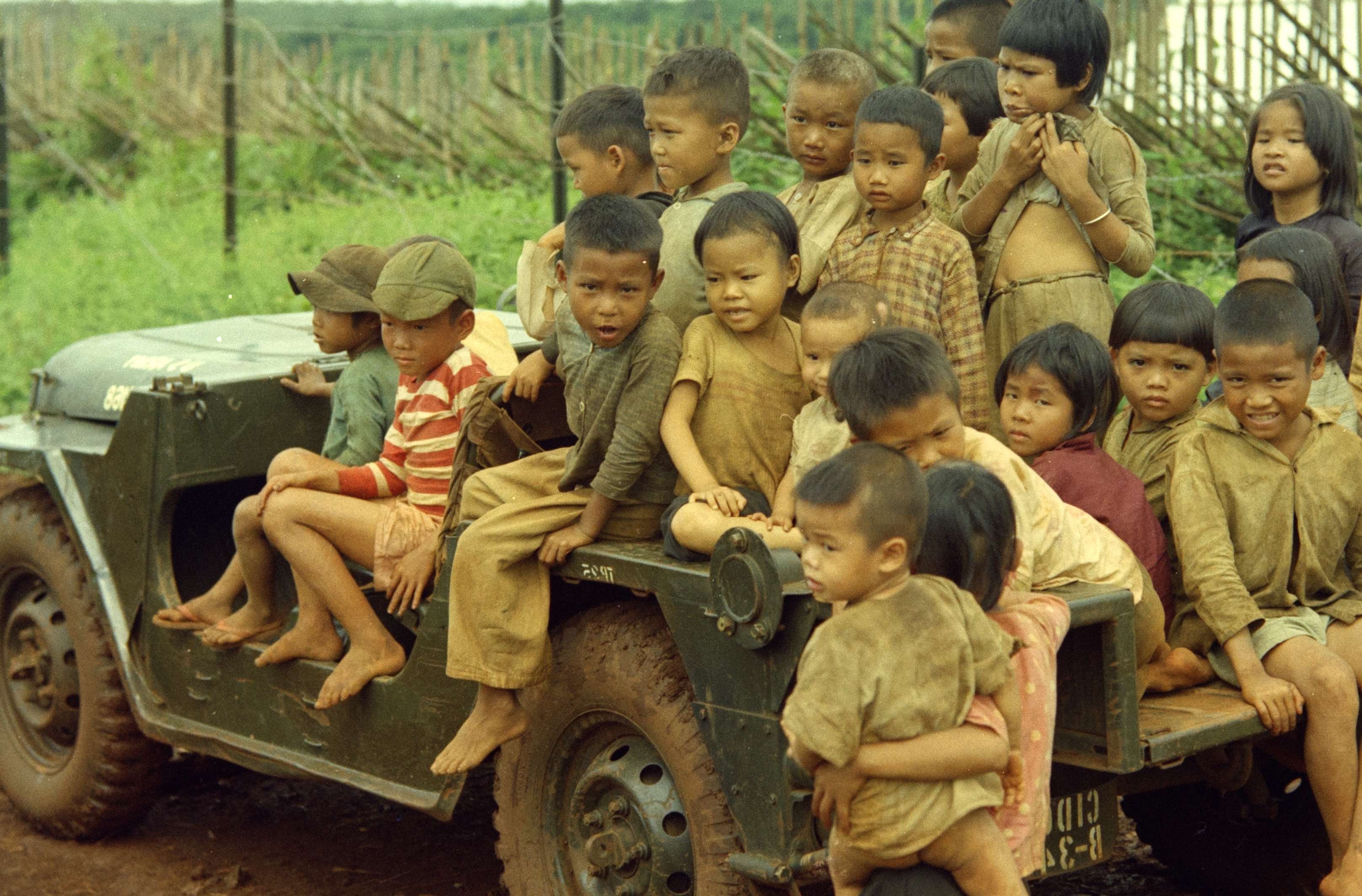 Photograph of Children Sitting in a Special Forces Jeep