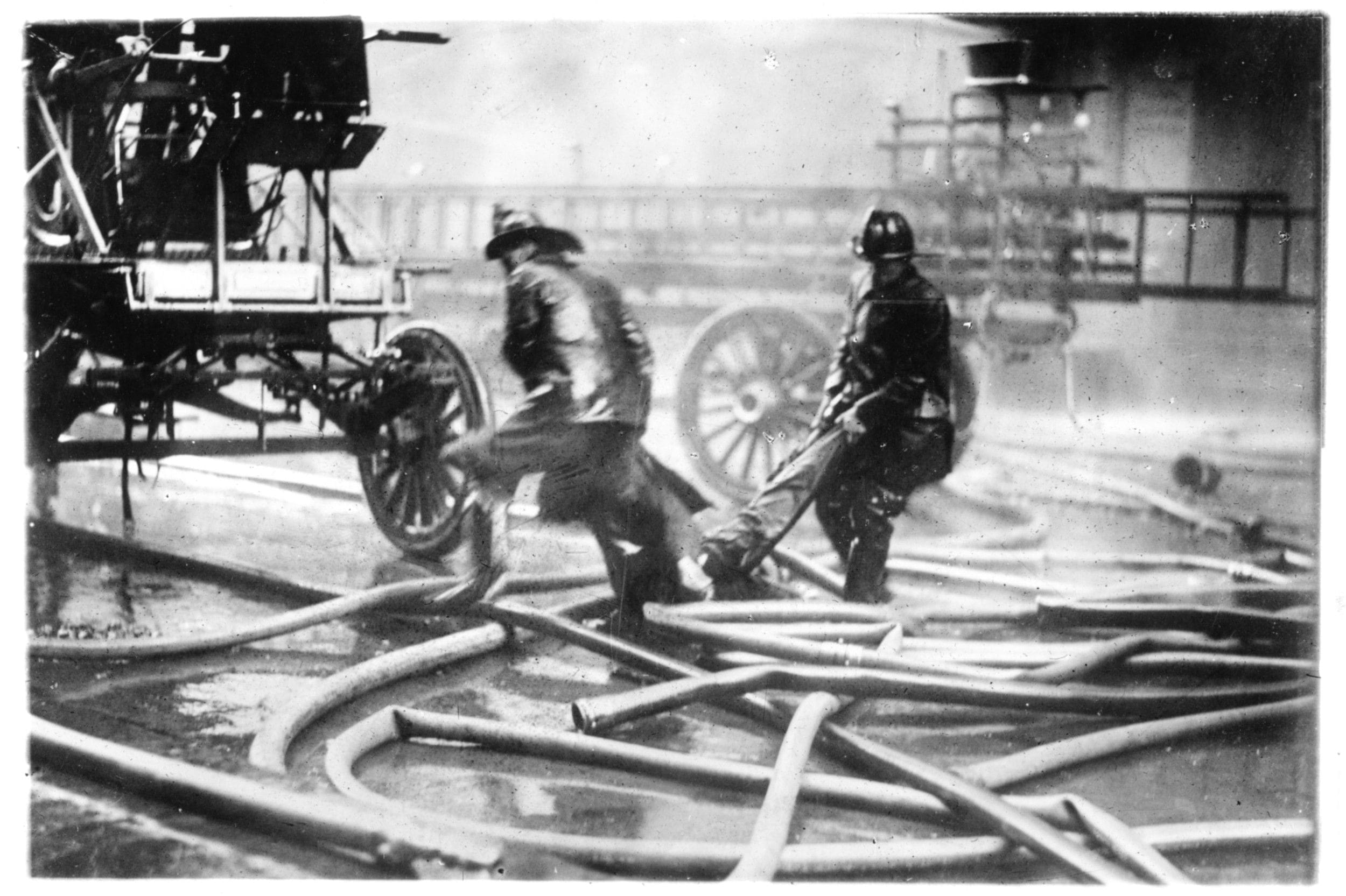 Photograph of Fire Fighters Carrying a Victim of the Triangle